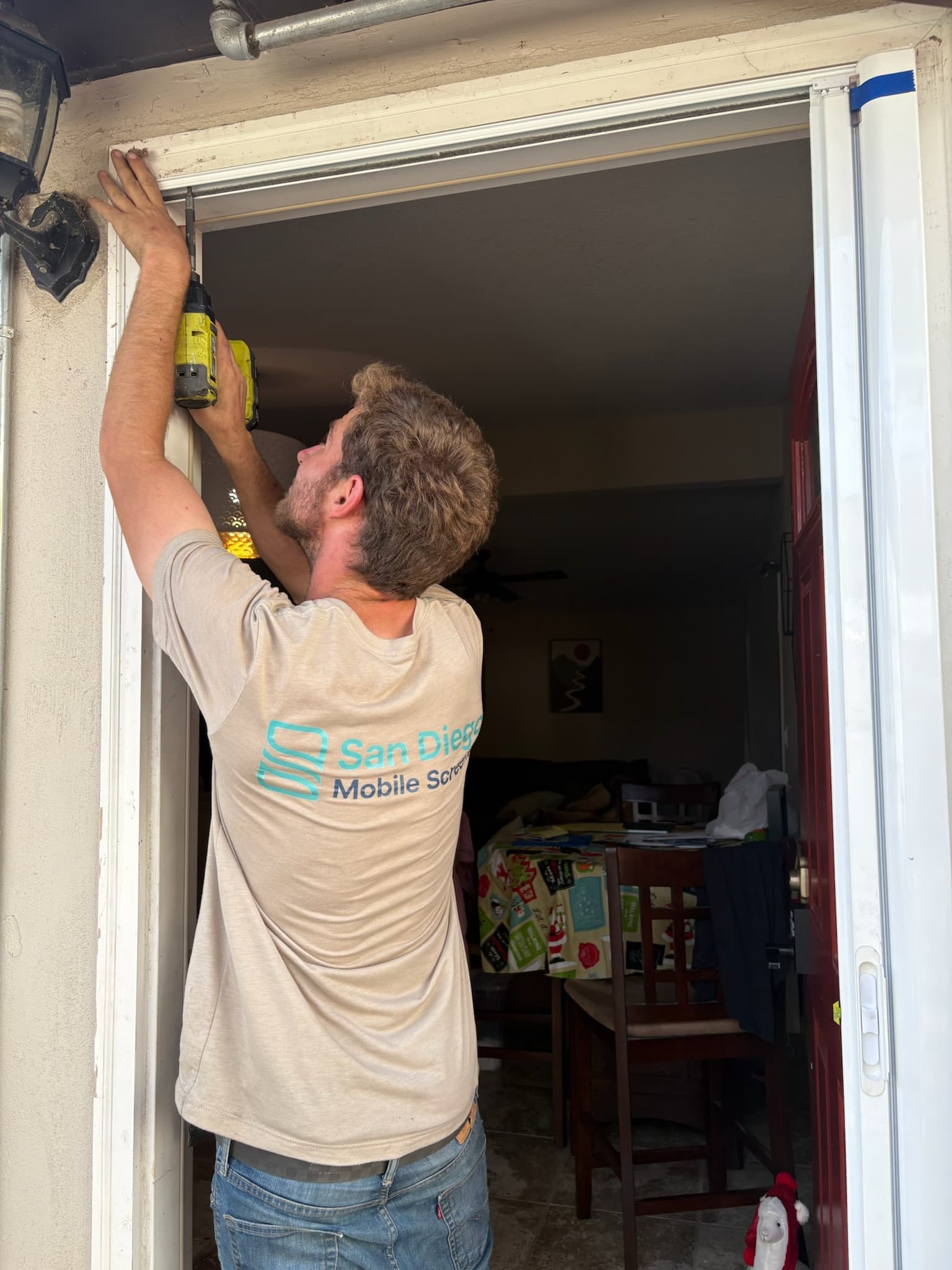 Security screen door installation on a San Diego home