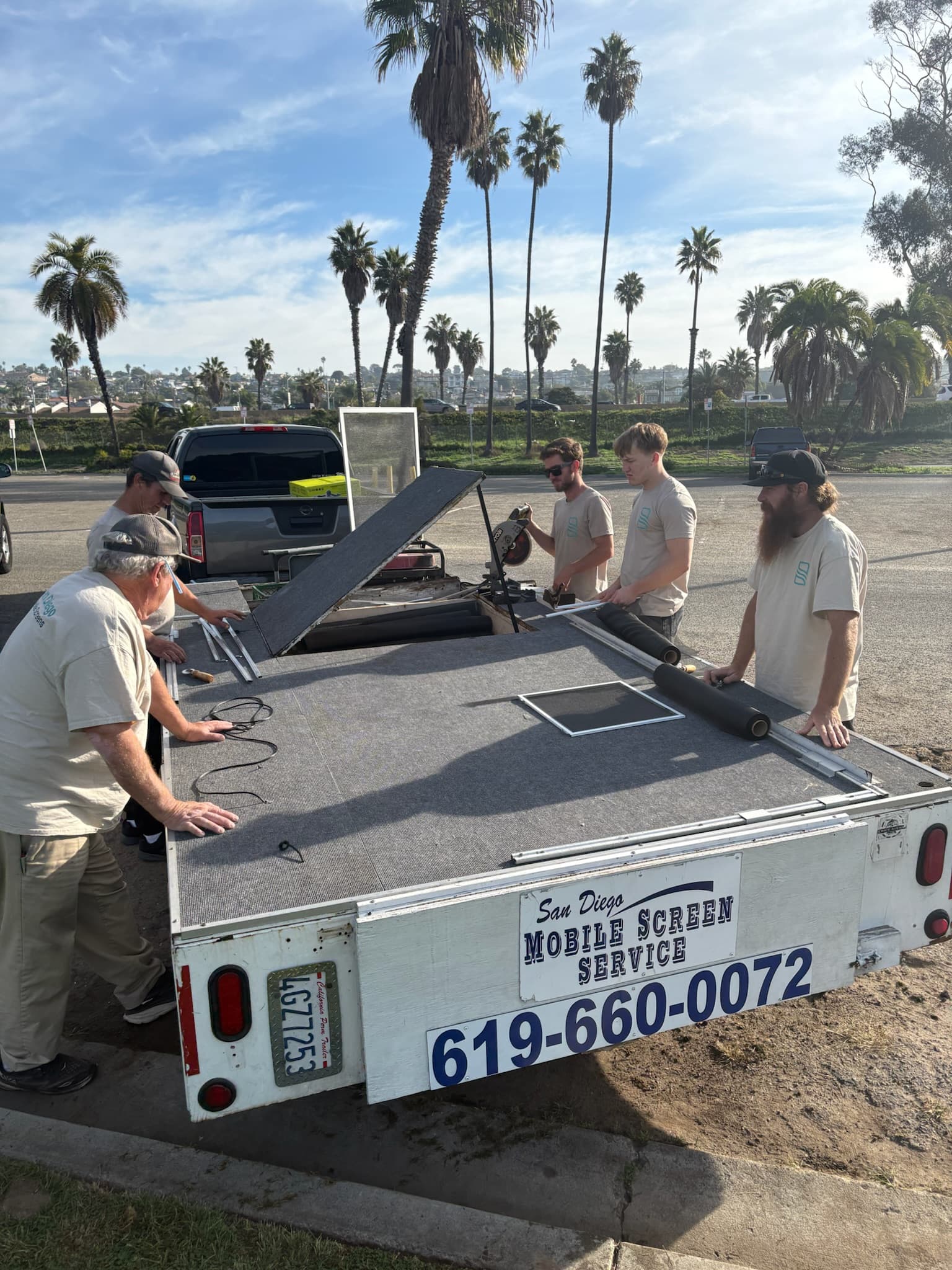 San Diego Mobile Screens team working at the mobile trailer workshop